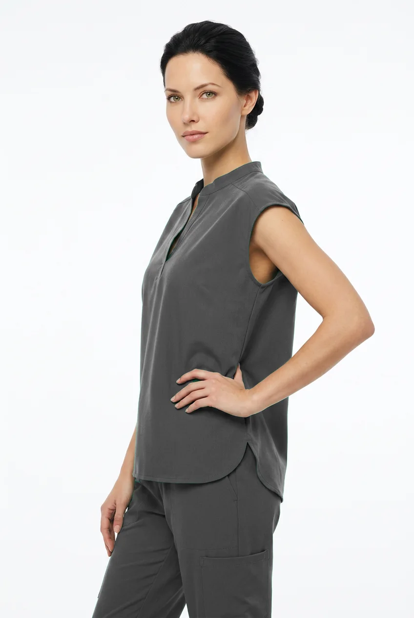 EliteMed cap-sleeve scrub top, worn, side view